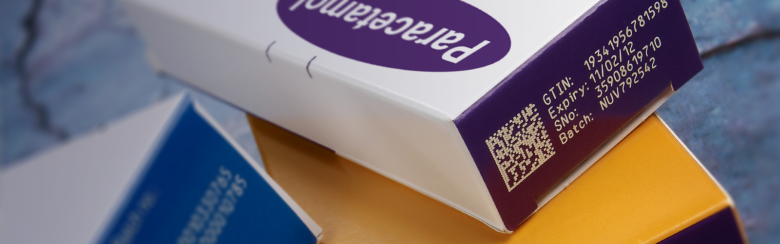 qr code, gtin, expiry date, serial number, and batch coded paracetamol cardboard outer packaging 