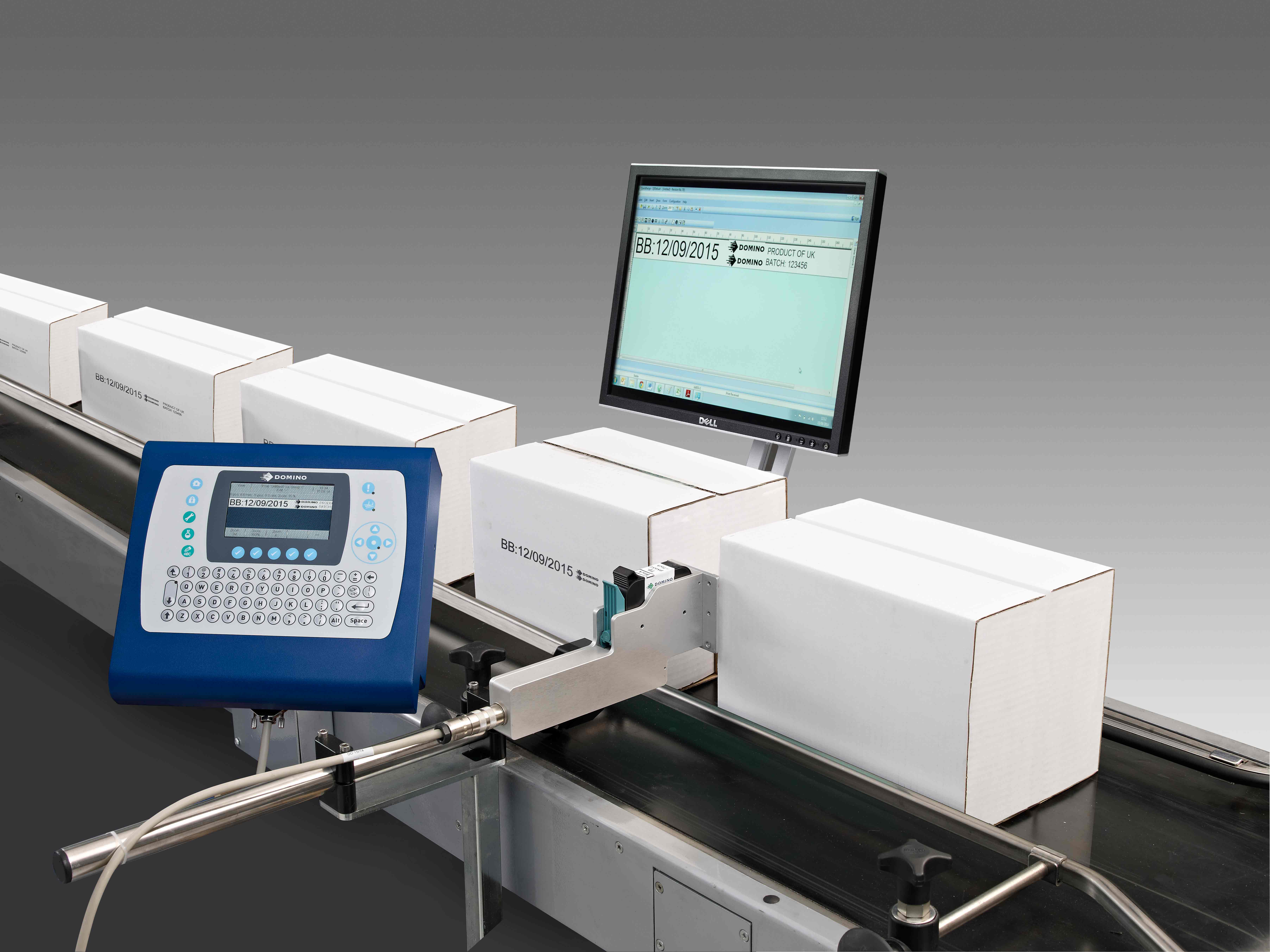 Domino's M-Series print and apply labeller applying label to white cardboard box