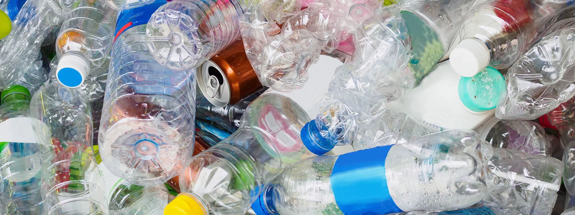 packaging waste including plastic bottles and aluminium cans for recycling