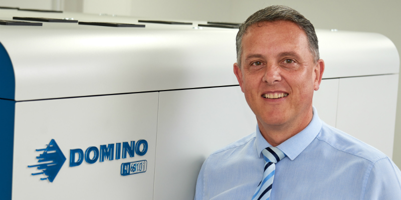 Anglia Labels ceo stands in front of new Domino press