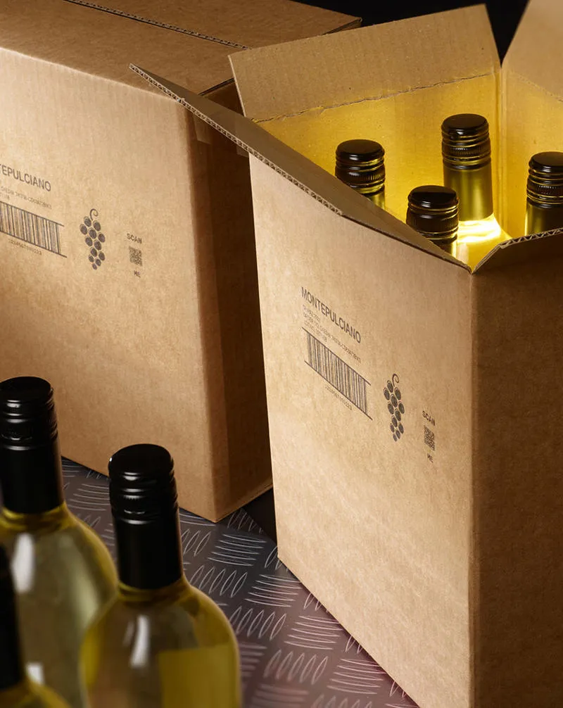 A group of wine bottles inside a porous cardboard box with a Cx150i code printed on the outside.