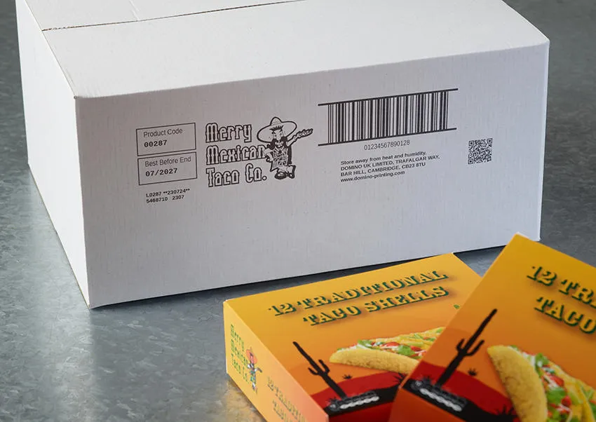 A white porous cardboard box with a Cx150i code printed on the outside as well as some boxes of taco shells.