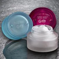 2029 date codes on blue and red glass cosmetic jars. These Date and Batch Codes were printed by Domino's D-Series CO2 Laser Marking Machine. For more information about Domino CO2 Lasers, contact your Domino representative.