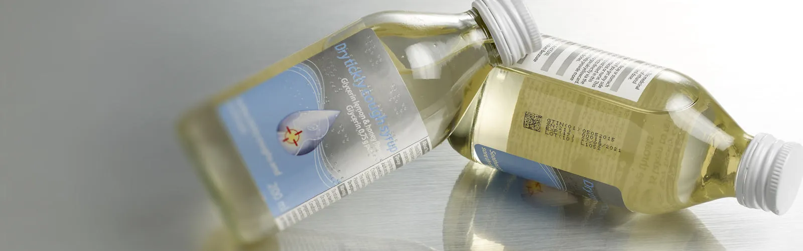 expiry date coded glass cough syrup pharma bottle with QR code banner