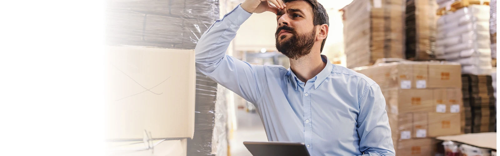 A banner image of a bearded man with his hand on his forehead looking confused and thinking 