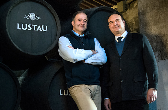 caballero wines employees in front of lustau barrel 