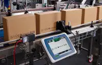 Gx-Series PRO printing onto brown boxes on a production line with UI