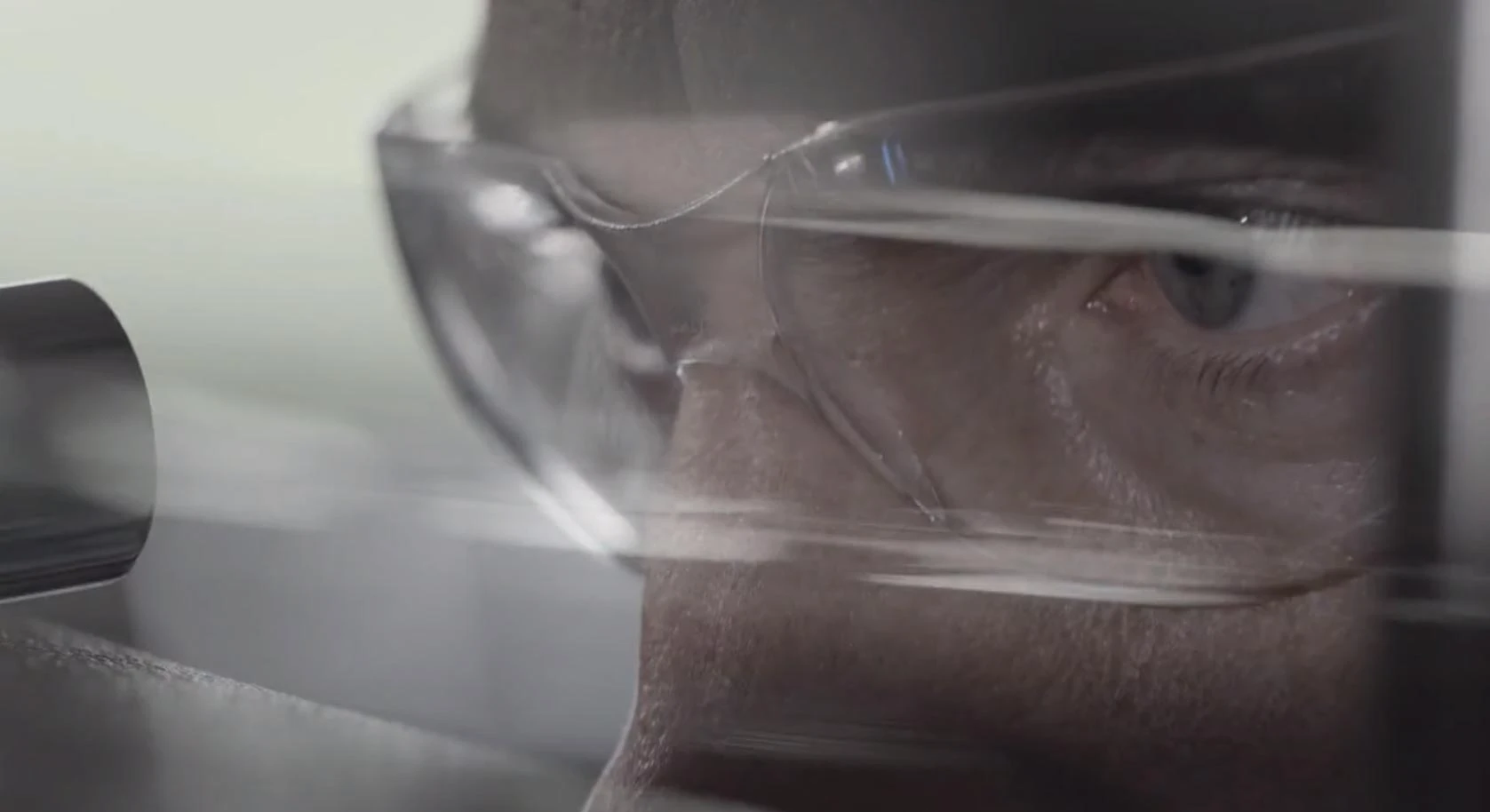 close up from bridge of nose to forehead of a persons face wearing eye protection spectacles 