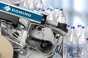 Automatic Label applicator machine- shrink wraped water bottles